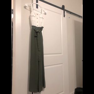 One piece jumper, white on top and olive green flow pants on bottom